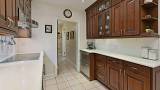 013-Stone-Countertops-and-Ample-Cabinetry.jpg