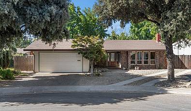 Elegant Single-Story Home with Gourmet Kitchen and Expansive Backyard Oasis